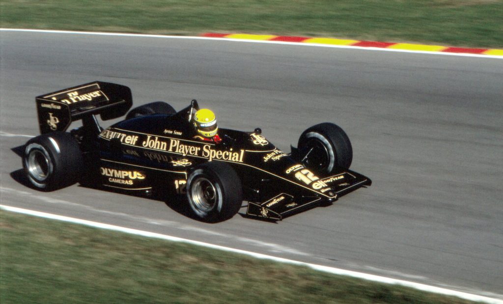 Ayrton Senna drives the black and gold number 12 Lotus 97T at Brands Hatch in 1985.