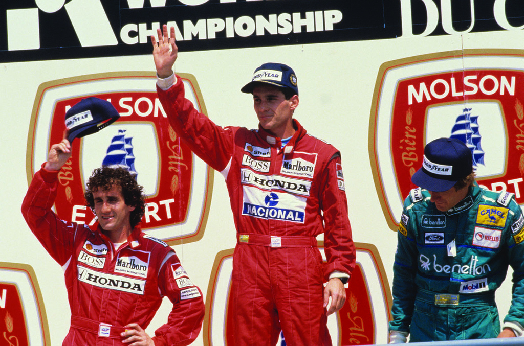 Ayrton Senna celebrates the 1988 Canadian Grand Prix with Alain Prost and Thierry Boutsen