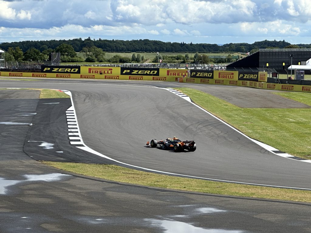 Lando Norris driving his McLaren Formula 1 car through a corner during qualifying at Silverstone.