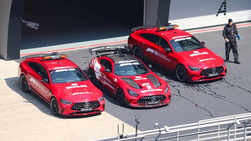 Formula 1 Safety Car and Medical Car parked outside garages at the 2026 Chinese Grand Prix.