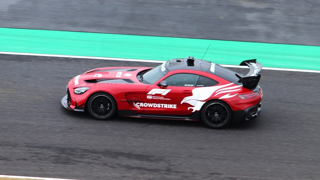 Red Mercedes-AMG Formula 1 Safety Car on track at Suzuka in 2025