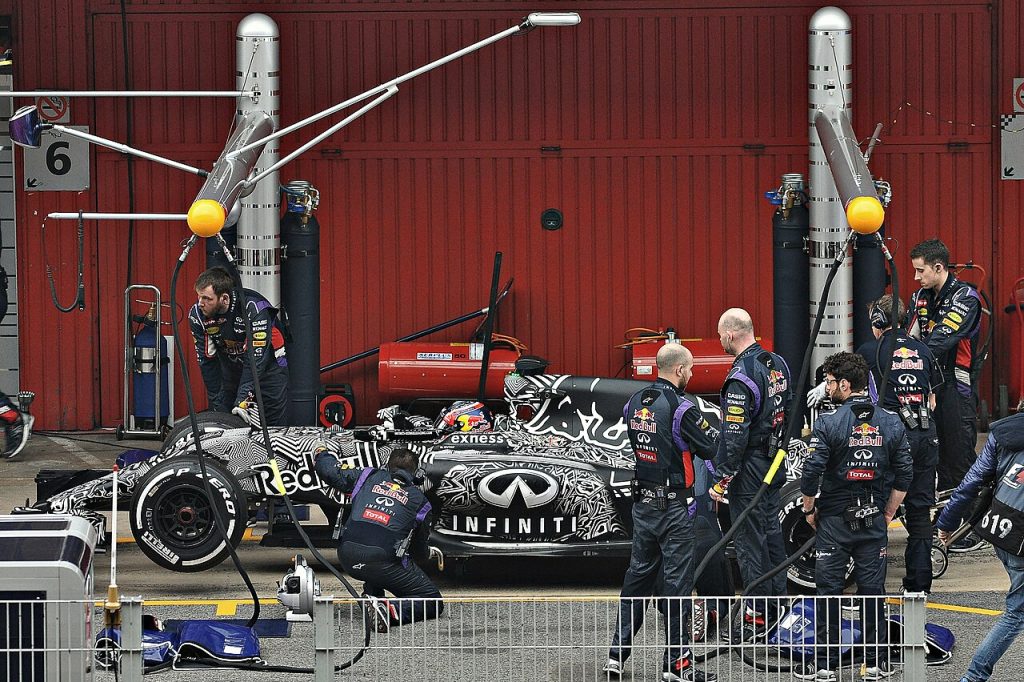 Red Bull mechanics with an F1 car during Barcelona testing in 2015